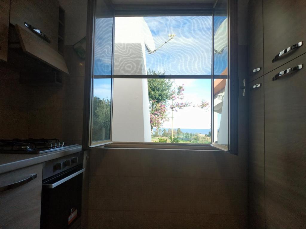 Kuchyňa alebo kuchynka v ubytovaní Vacanza in Ogliastra