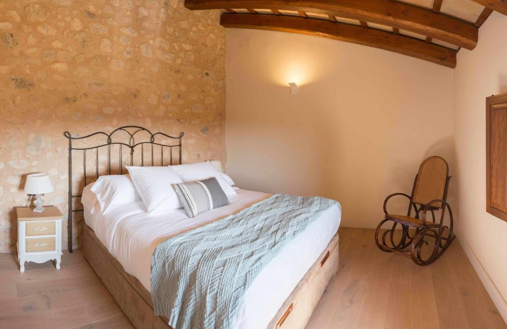 Posteľ alebo postele v izbe v ubytovaní Casa rural Masia Les Apieres