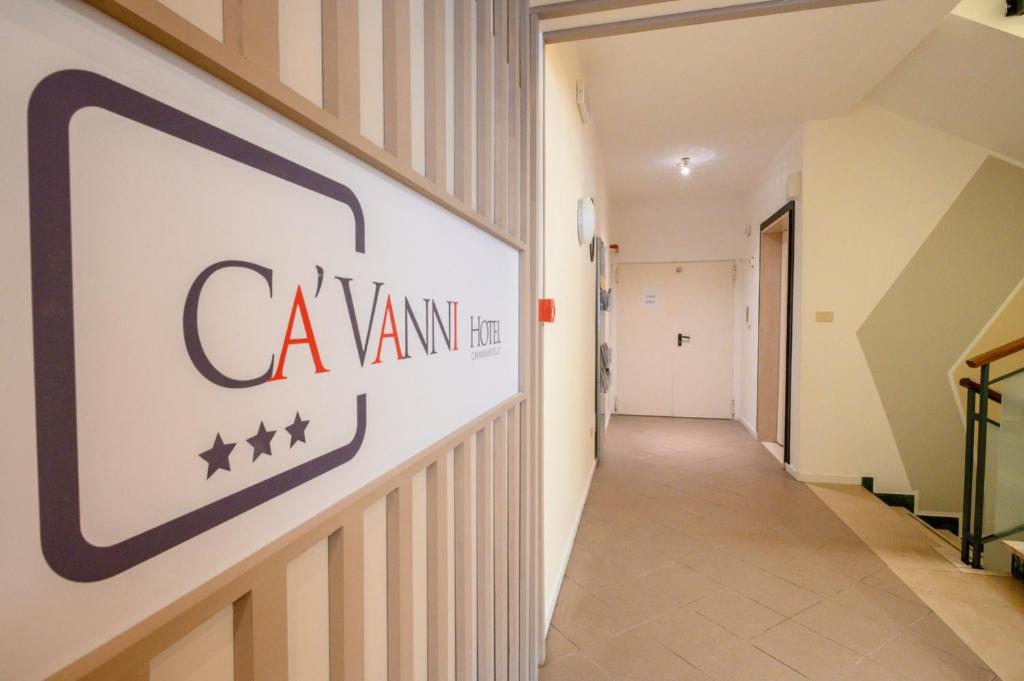 a hallway in a hospital with a sign on the wall at Hotel Cà Vanni in Rimini