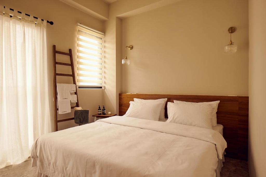 Letto o letti in una camera di Sunlight Homestay