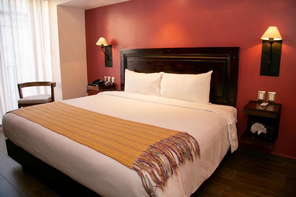 Postel nebo postele na pokoji v ubytování Hotel Alameda Centro Historico