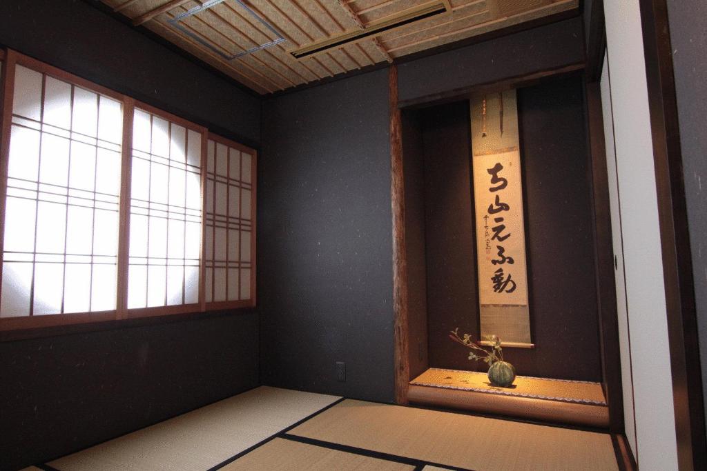 Postel nebo postele na pokoji v ubytování Kizashi The Suite Kyoto Gion