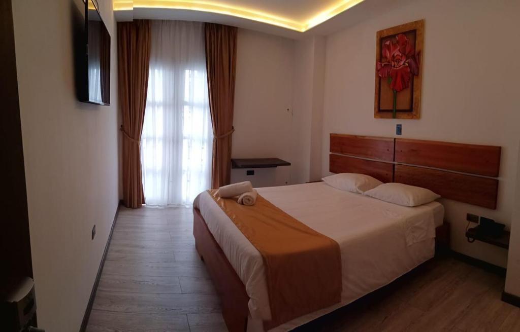 Postel nebo postele na pokoji v ubytování Hotel Válcon