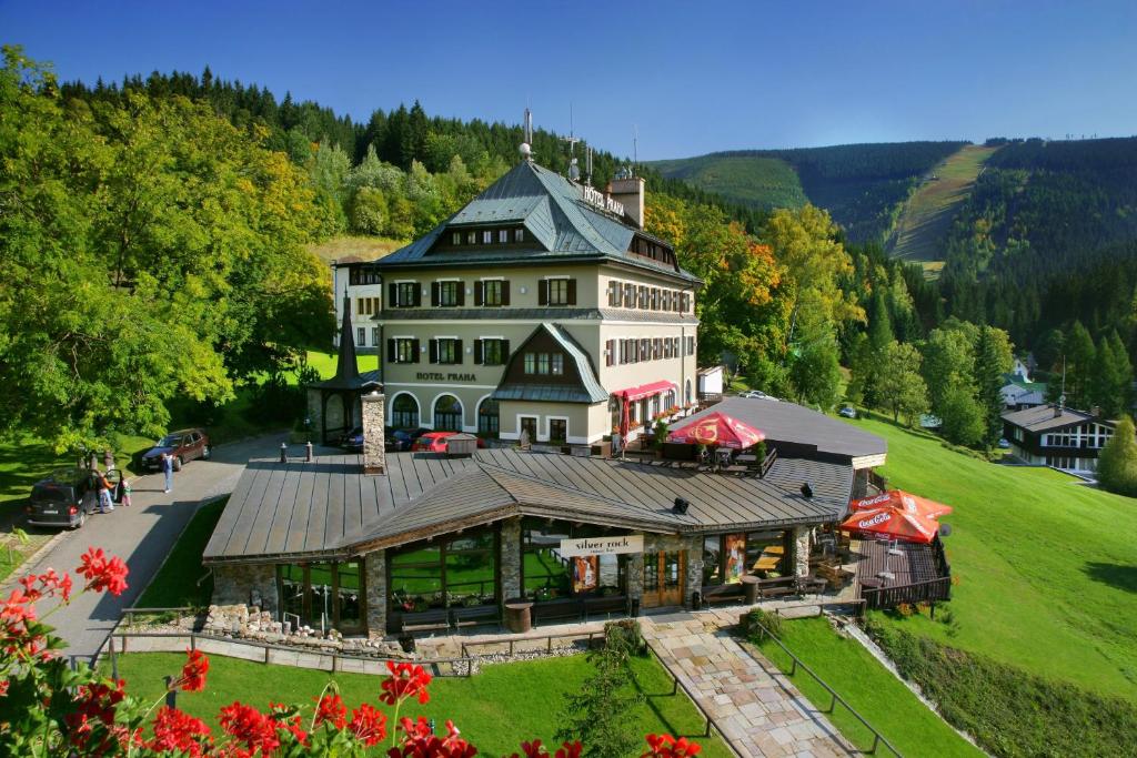 an aerial view of a large building on a hill at Hotel Praha in Špindlerův Mlýn