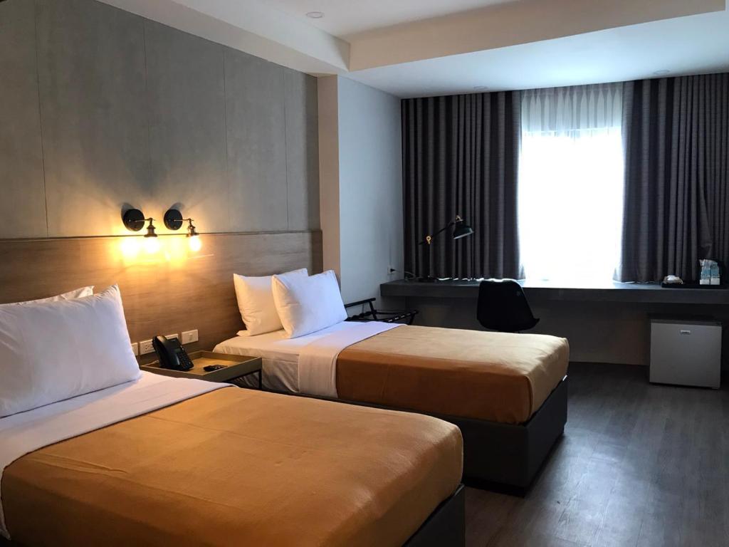 Postel nebo postele na pokoji v ubytování JET Hotel