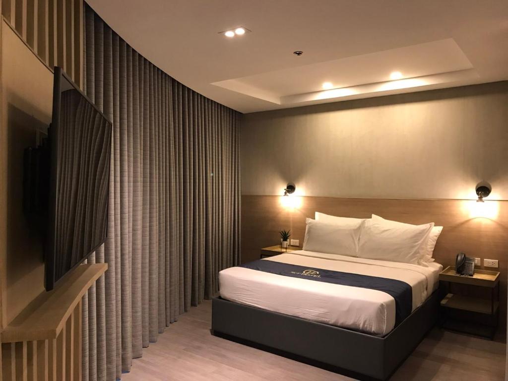 Postel nebo postele na pokoji v ubytování JET Hotel