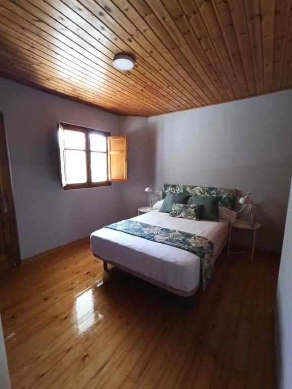 A bed or beds in a room at LA CAPILLA
