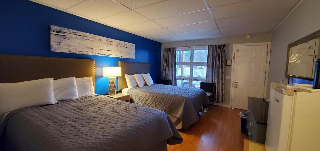 Postel nebo postele na pokoji v ubytování Lido Motel Lake George