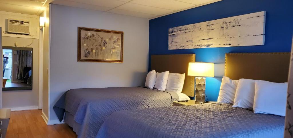 Postel nebo postele na pokoji v ubytování Lido Motel Lake George