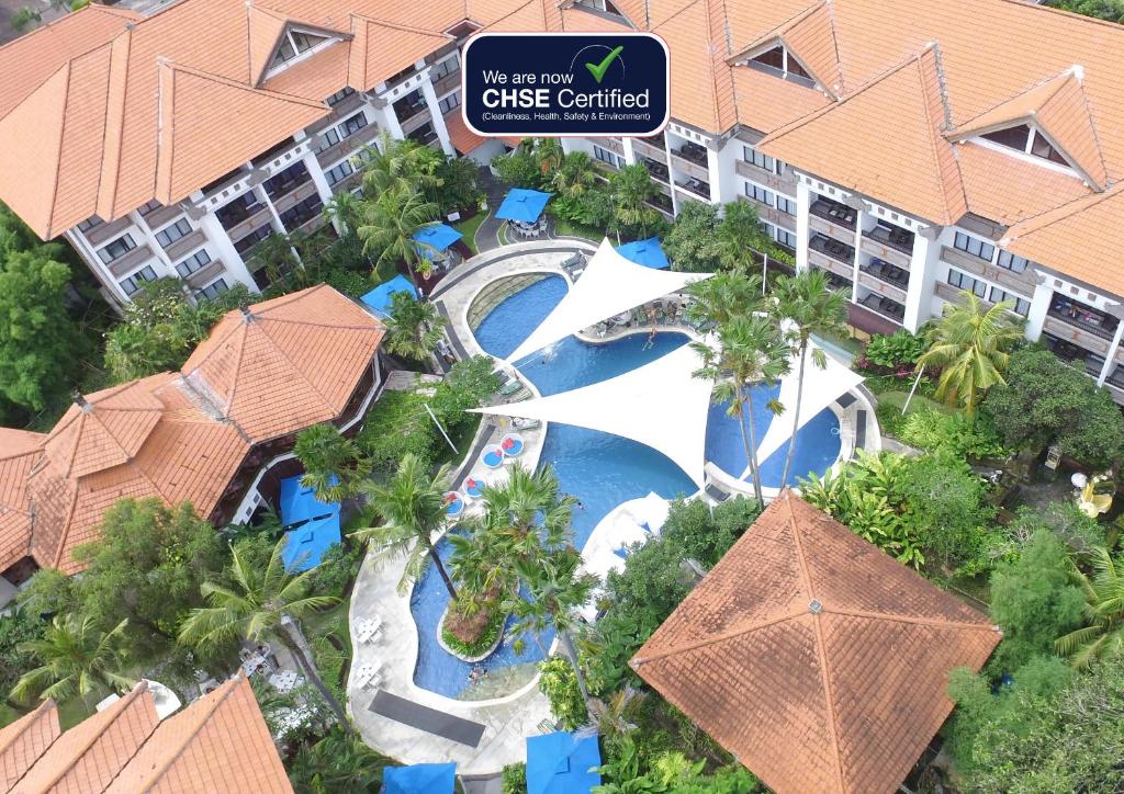 an aerial view of a pool at a resort at Prime Plaza Suites Sanur – Bali in Sanur