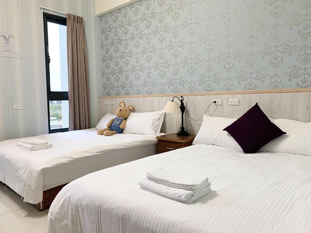 Postel nebo postele na pokoji v ubytování Forrest Cafe Villa