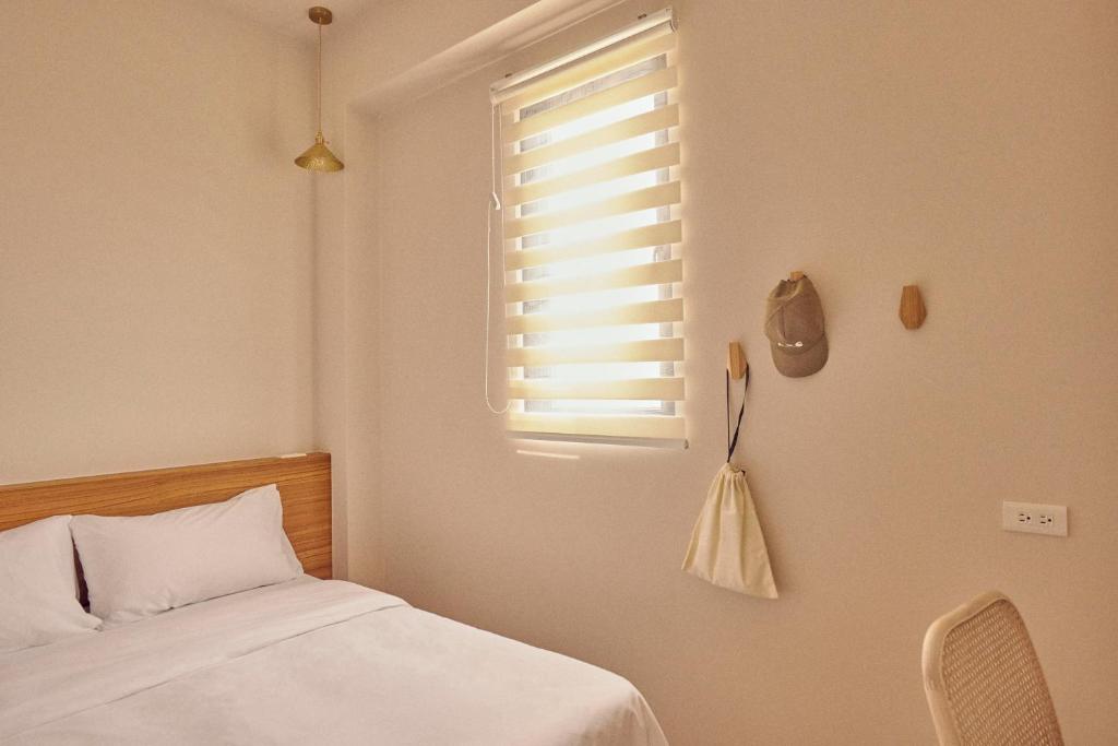 Letto o letti in una camera di Sunlight Homestay