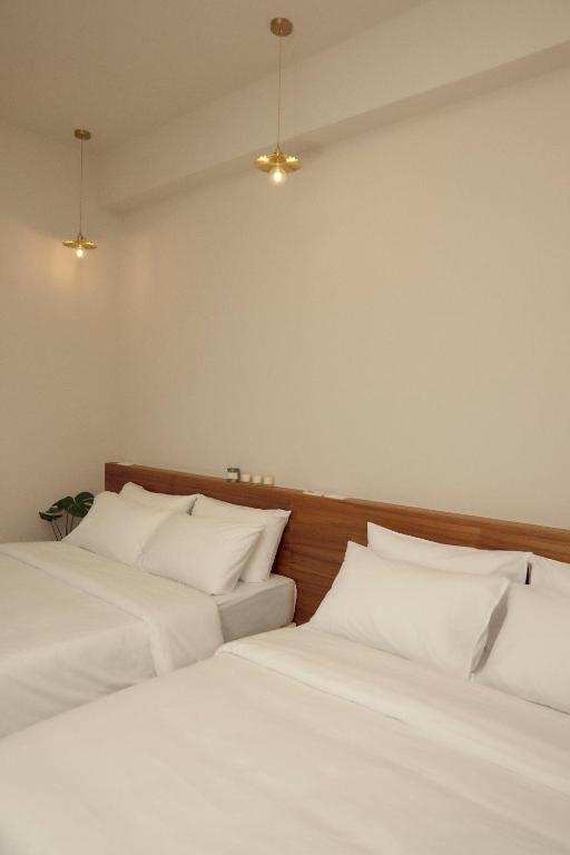 Letto o letti in una camera di Sunlight Homestay