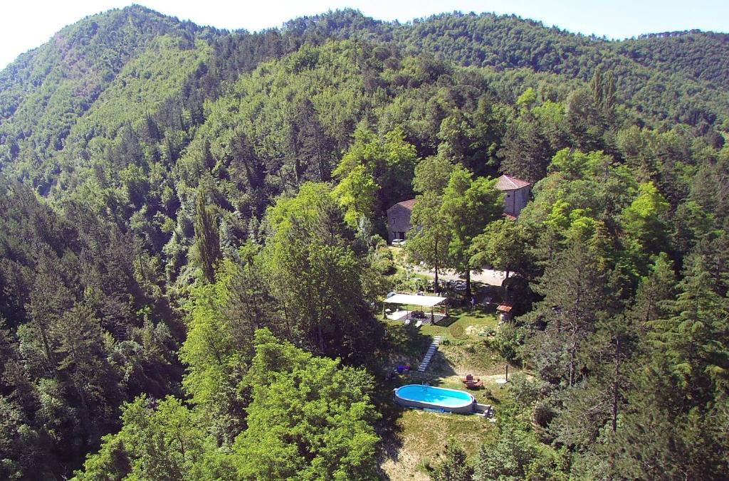 an aerial view of a house in the middle of a mountain at Porcaticcio in Casola Valsenio