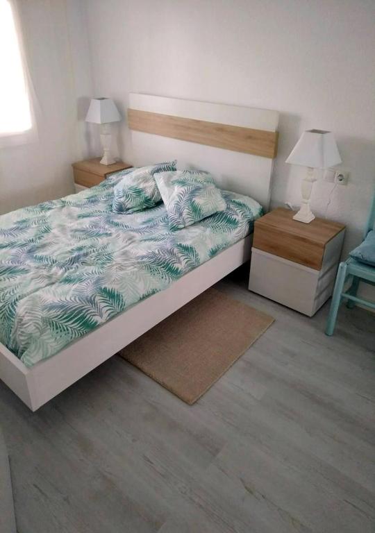 Posteľ alebo postele v izbe v ubytovaní Apartamentos Stil Mar Anna - Stil Mar Jardin Anna