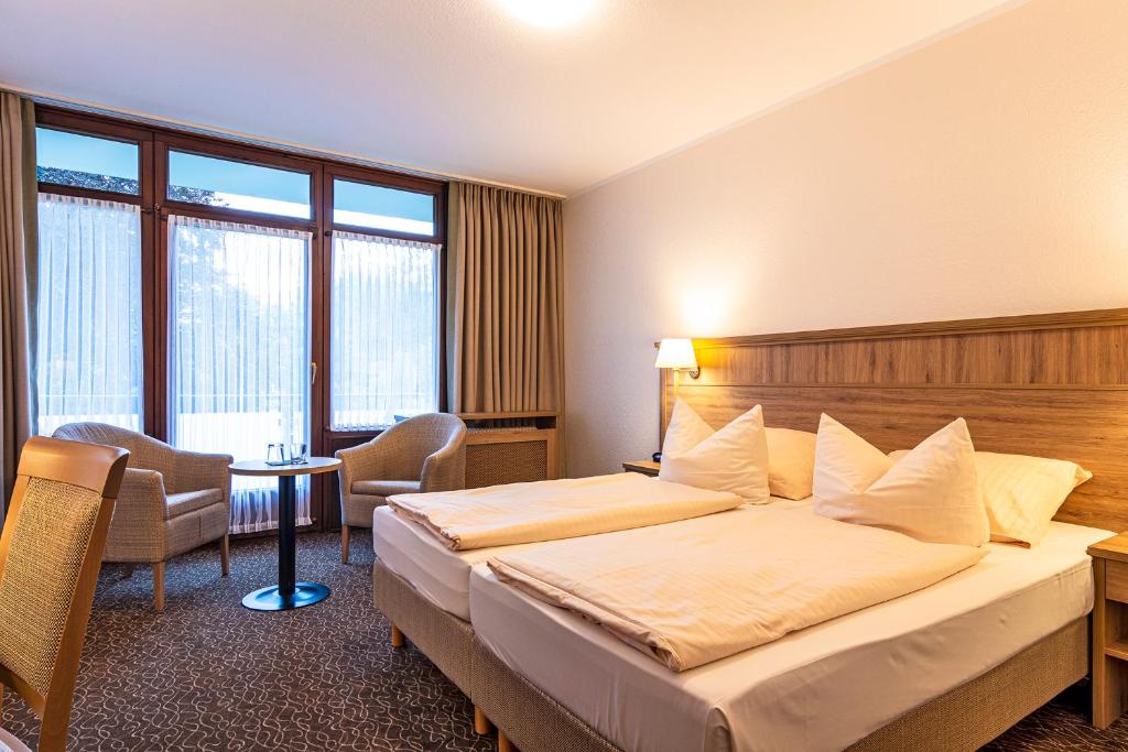 Postel nebo postele na pokoji v ubytování AMBER HOTEL Bavaria