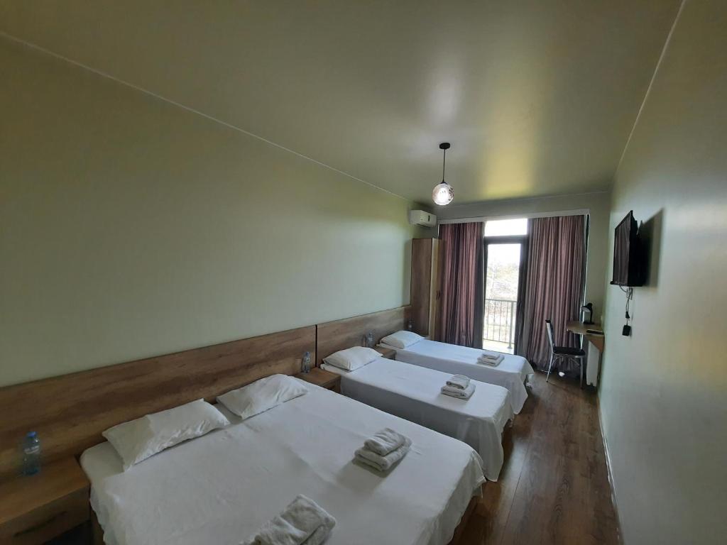 Postel nebo postele na pokoji v ubytování Delta Hotel