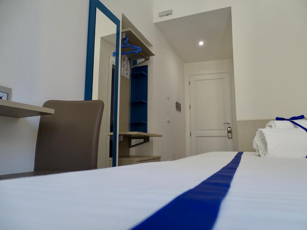 Postel nebo postele na pokoji v ubytování Le Quattro Stagioni - Rooms & Suites