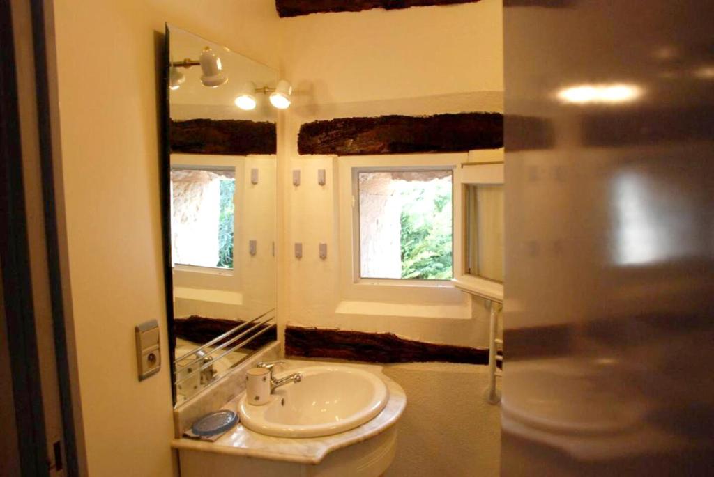 a bathroom with a sink and a mirror at Maison de 2 chambres avec jardin clos et wifi a Cajarc in Cajarc
