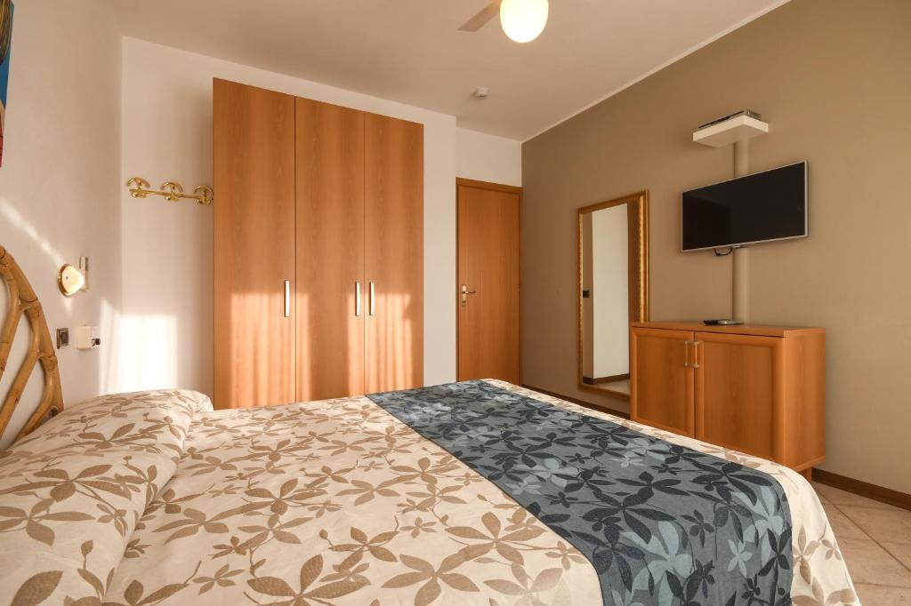 Postel nebo postele na pokoji v ubytování Apparthotel San Sivino