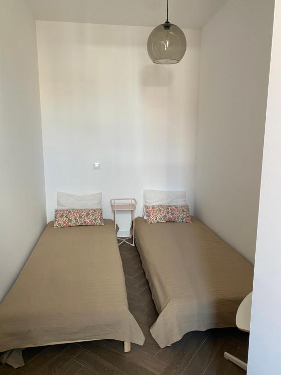 A bed or beds in a room at Atic Port Experience