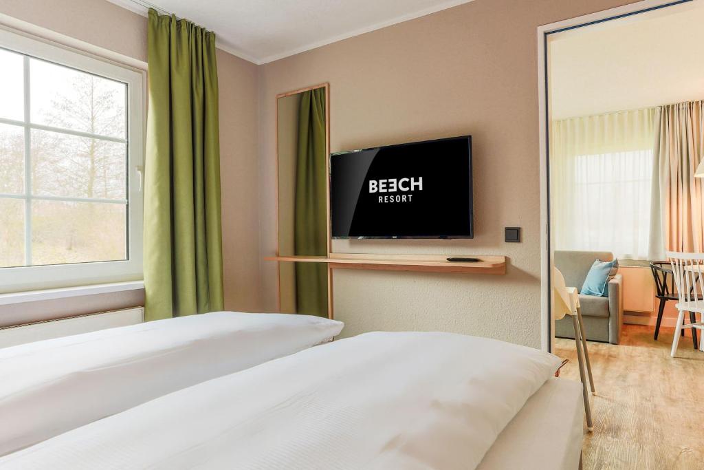 TV a/nebo společenská místnost v ubytování BEECH Resort Fleesensee
