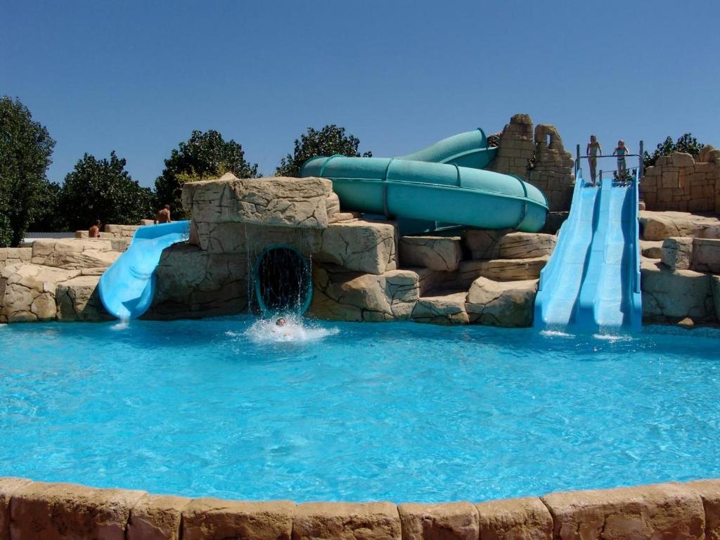 a water slide in a water park at Mobil home BASSET au camping à St Hilaire de Riez 400m de la mer in Saint-Hilaire-de-Riez