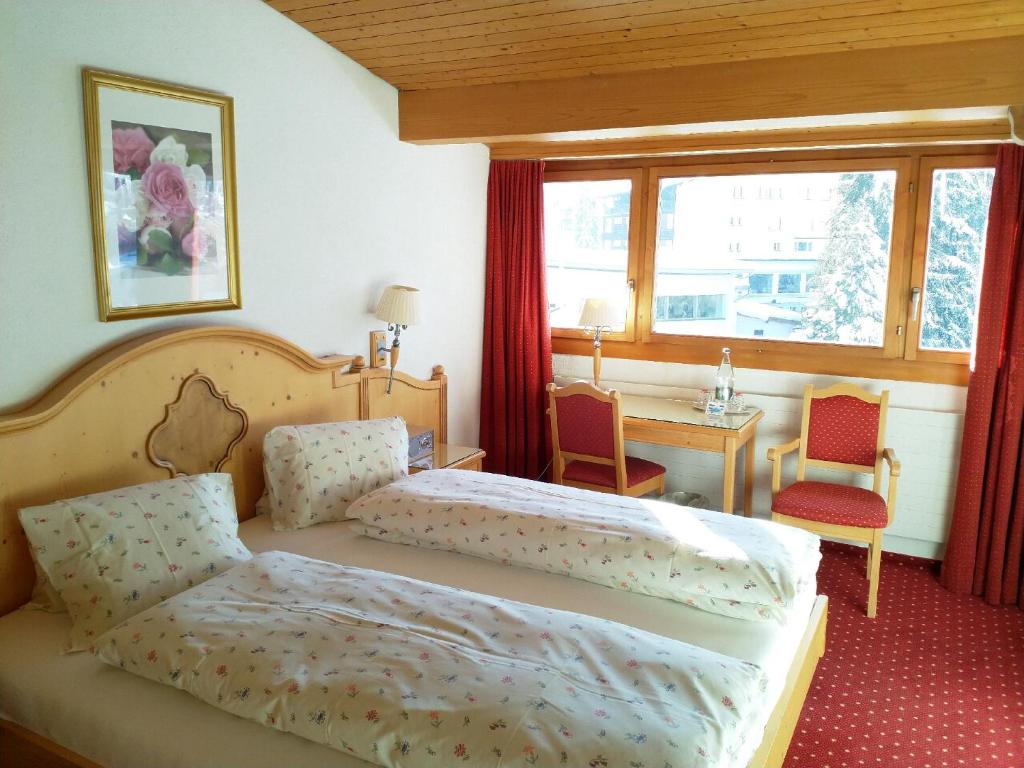 Postel nebo postele na pokoji v ubytování Hotel Cresta