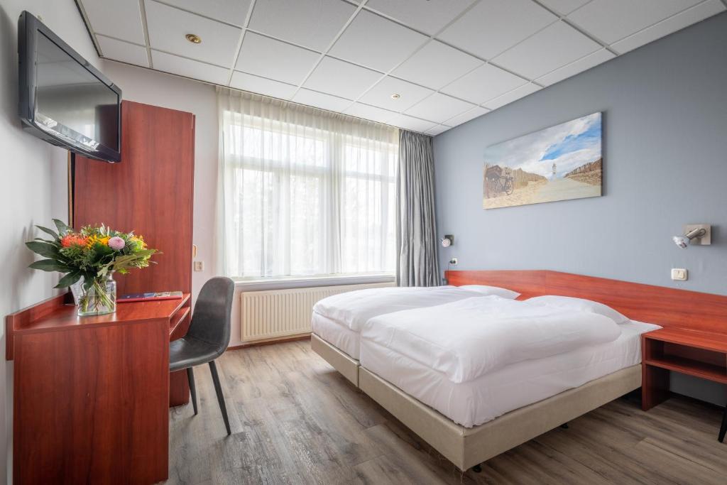 TV a/nebo společenská místnost v ubytování Two Brothers Hotel Astoria