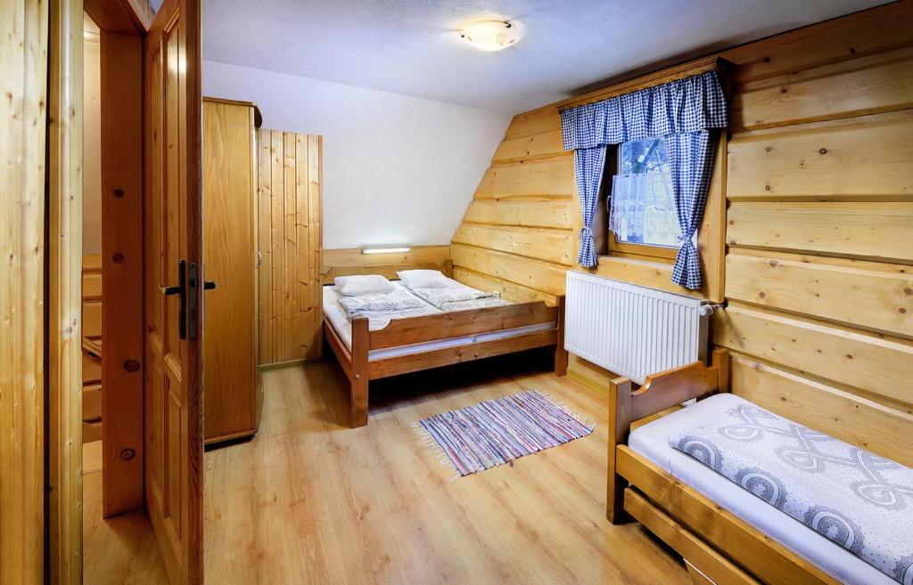 Postel nebo postele na pokoji v ubytování Chalupa Goral