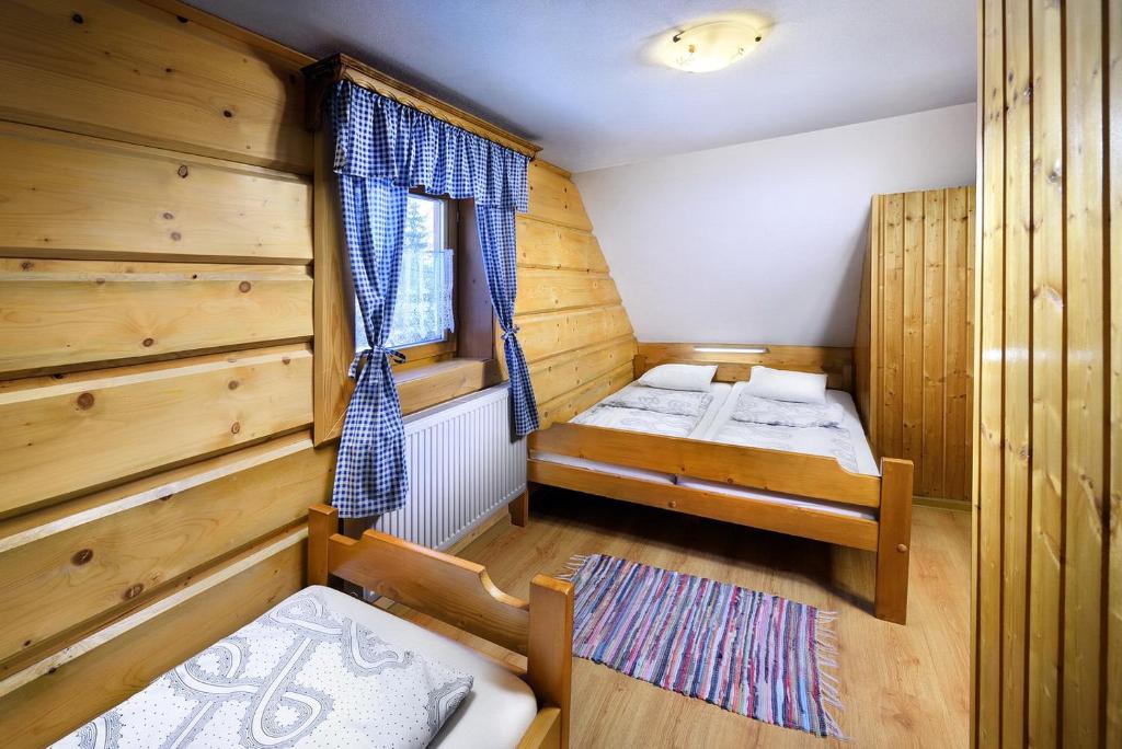 Postel nebo postele na pokoji v ubytování Chalupa Goral