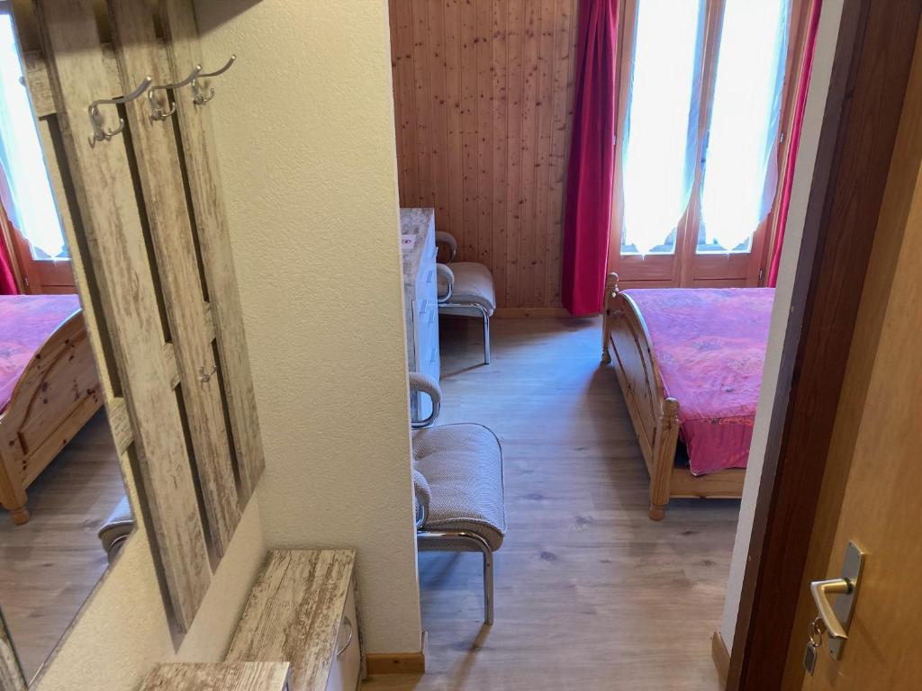 Postel nebo postele na pokoji v ubytování Hôtel du Gd-St-Bernard