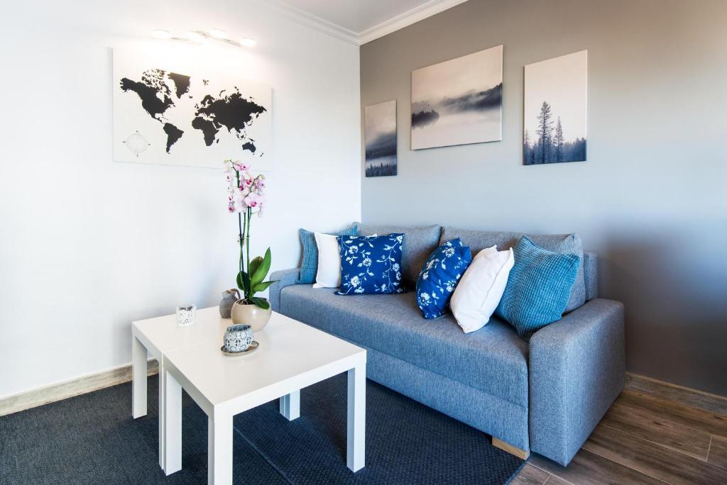 A seating area at Beachfront apartment Puerto Marina