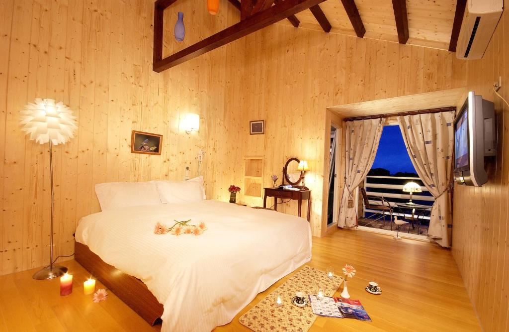 Postel nebo postele na pokoji v ubytování Dongshan River Resort Farm
