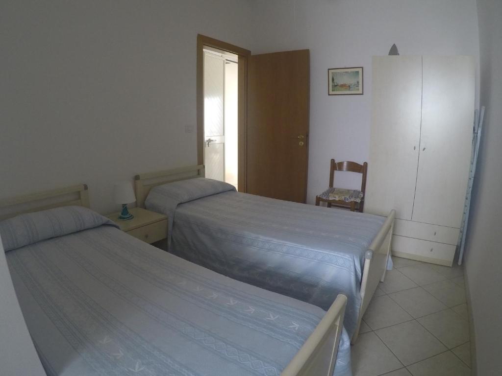 A bed or beds in a room at Casa vacanze a Pescoluse (80 mt dal mare)