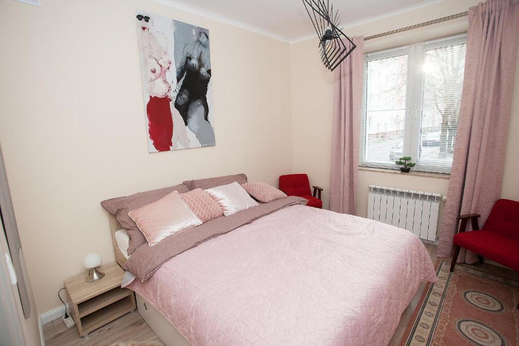 Posteľ alebo postele v izbe v ubytovaní Apartament Golden