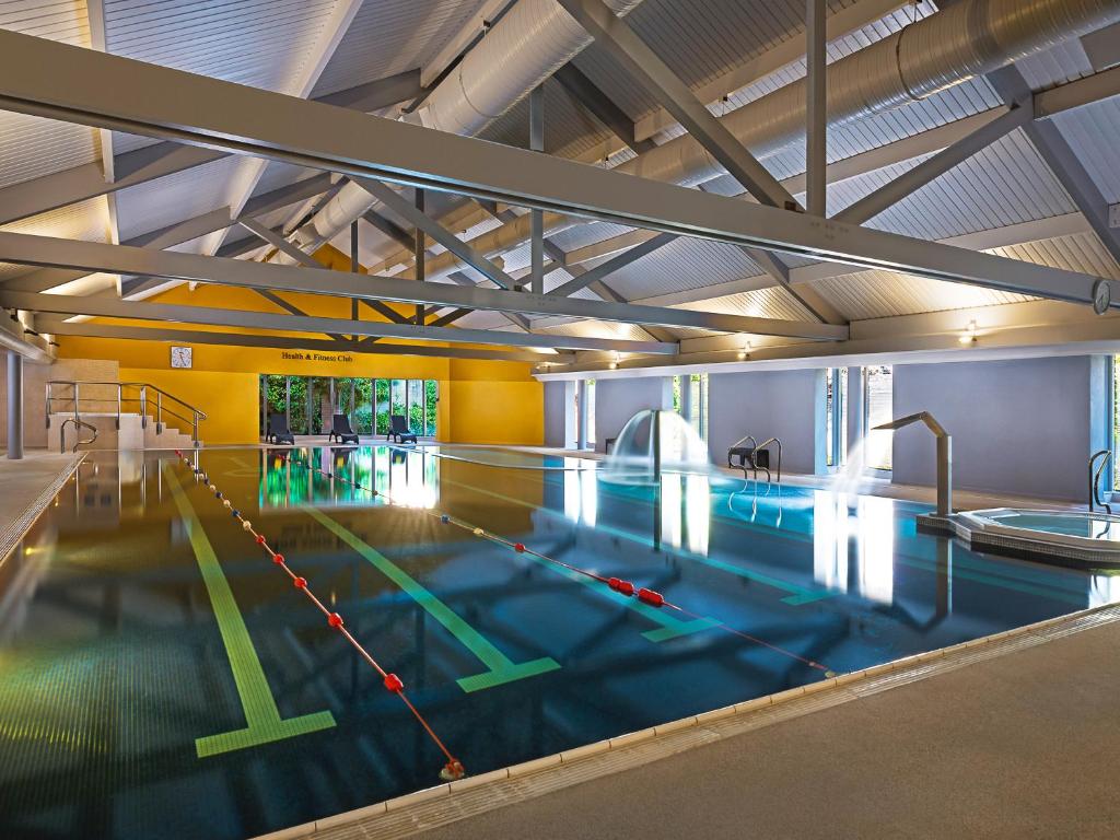 a large indoor swimming pool in a building at Midlands Park Hotel in Portlaoise