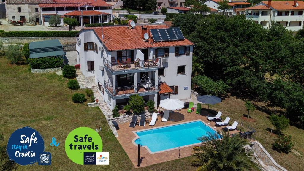 an aerial view of a house with a swimming pool at Apartments Villa Verde-Adults Only in Mušalež