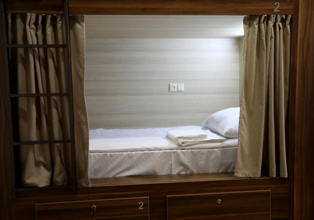 Postel nebo postele na pokoji v ubytování Loft Host Yerevan