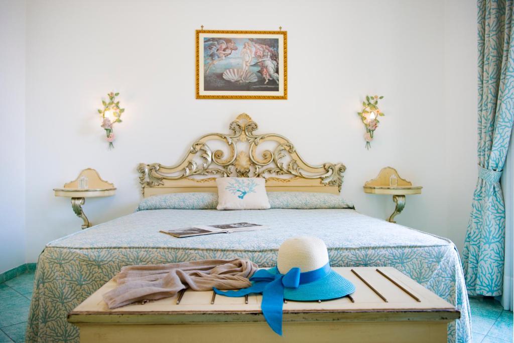 Postel nebo postele na pokoji v ubytování Hotel Royal Prisco