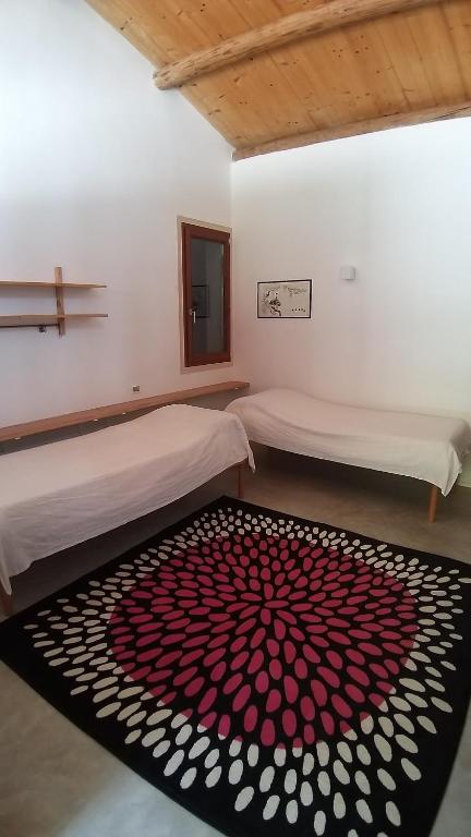 Łóżko lub łóżka w pokoju w obiekcie Agriturismo Corte del Maso