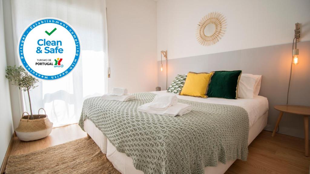 Кровать или кровати в номере DA'HOME - Marquês Lovely 2BD Apartment