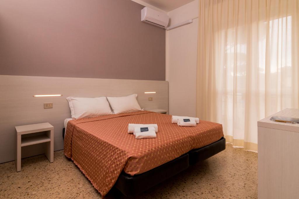 Postel nebo postele na pokoji v ubytování Hotel Lydia