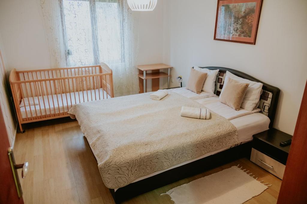 Postel nebo postele na pokoji v ubytování Vila Dinka
