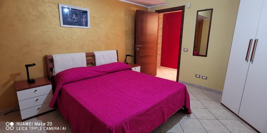 Postel nebo postele na pokoji v ubytování Maresole tra l'Etna e Taormina