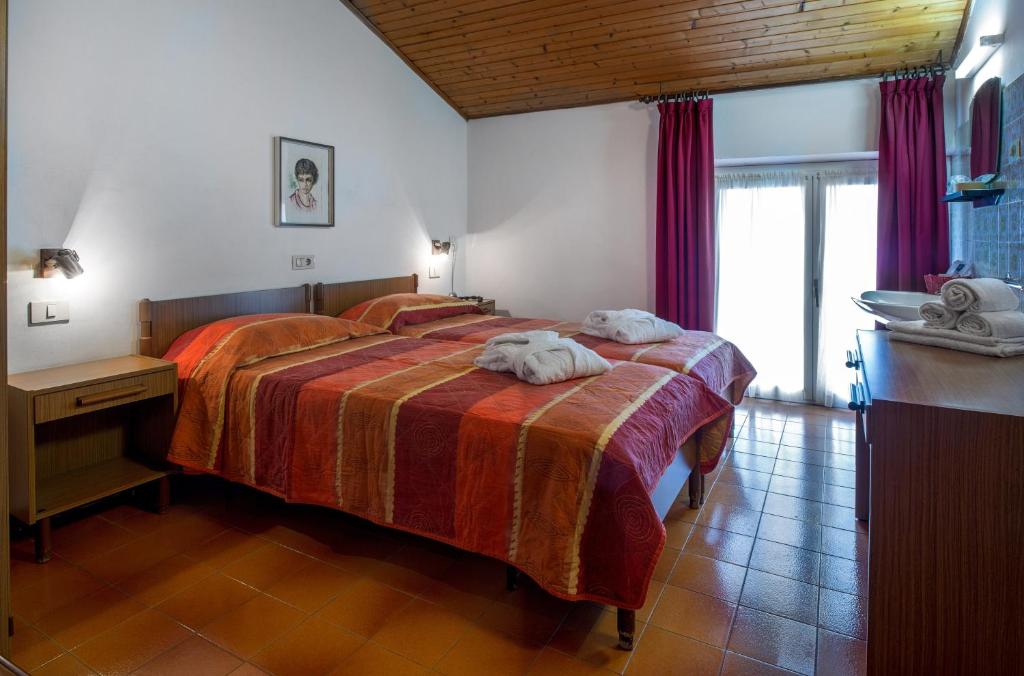 Fotografie z fotogalerie ubytování Albergo Villa Mimosa v destinaci Nago-Torbole