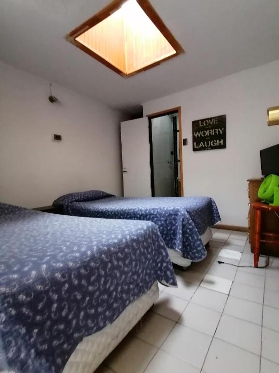 Postel nebo postele na pokoji v ubytování Hostal Caleta Abarca