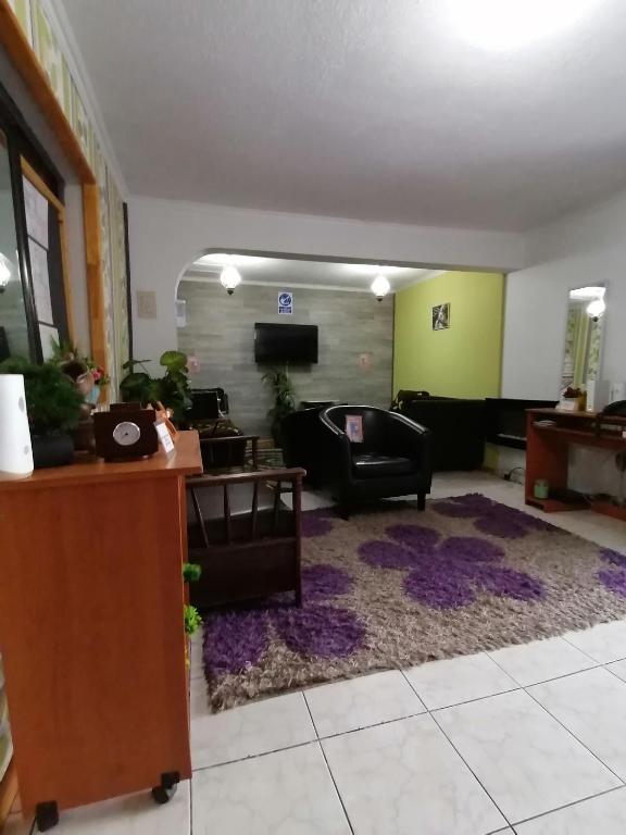 TV a/nebo společenská místnost v ubytování Hostal Caleta Abarca