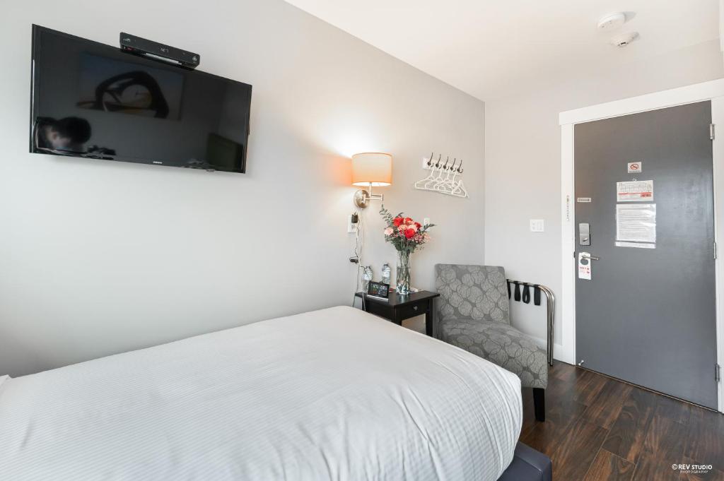Postel nebo postele na pokoji v ubytování Queens Hotel