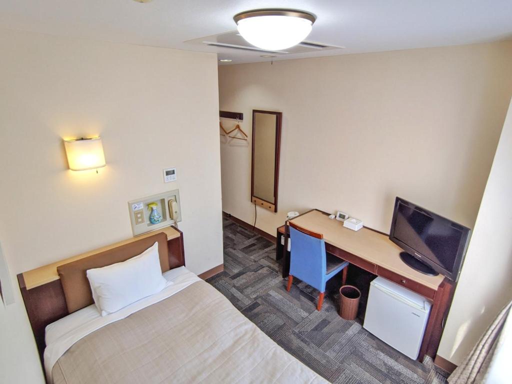 Ένα ή περισσότερα κρεβάτια σε δωμάτιο στο Kadoma Public Hotel / Vacation STAY 33572